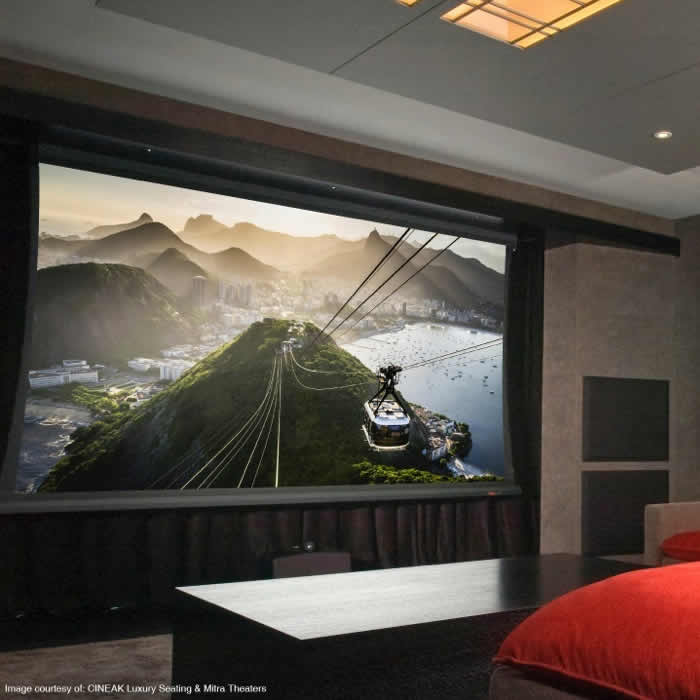 Home theater with a large projection screen and luxury seating