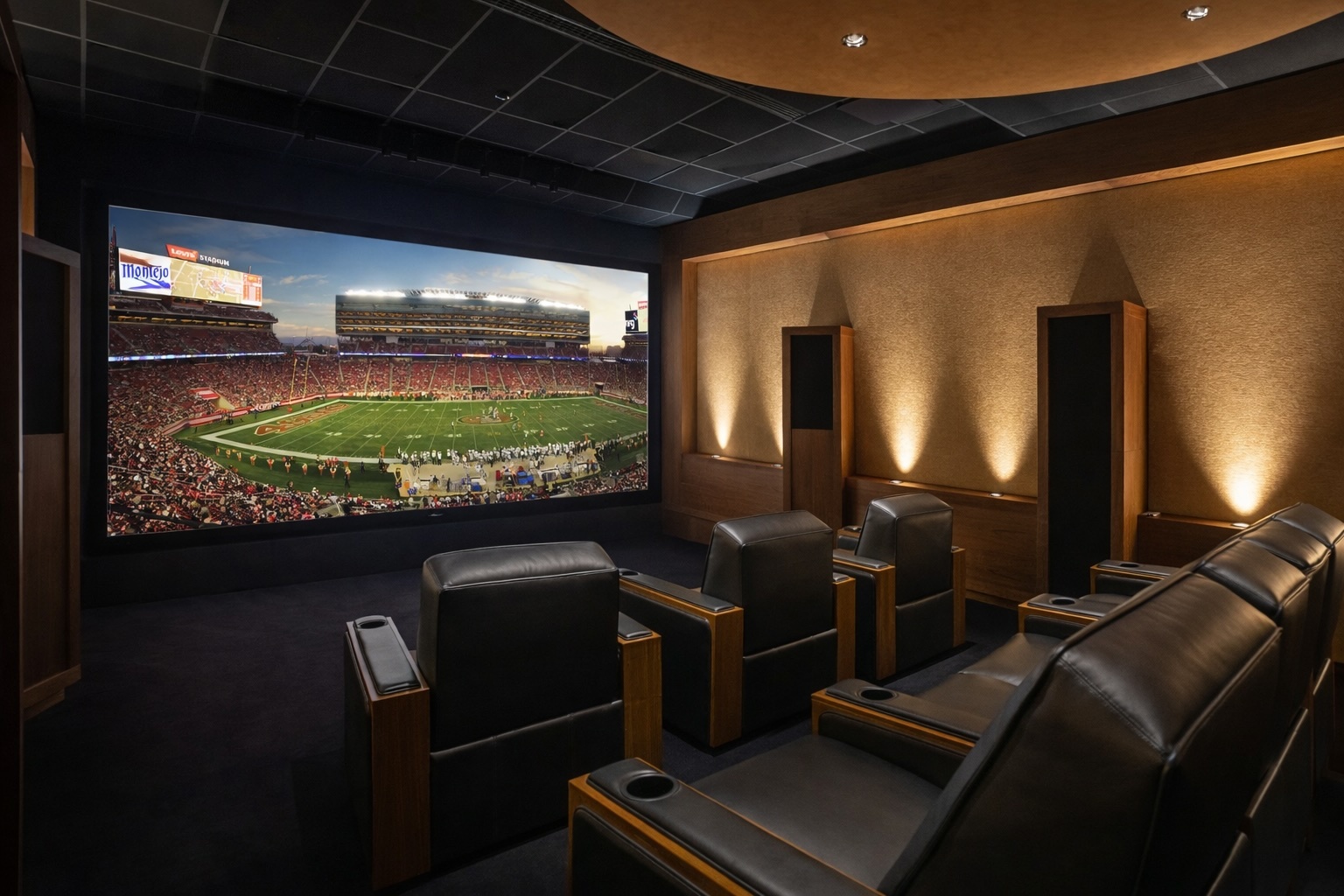 Home theater with leather recliners and a big screen showing a live sporting event