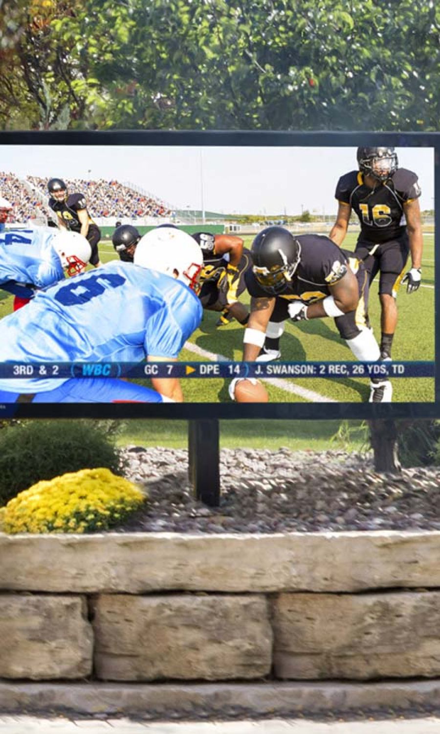 bright television outdoor on a rock wall