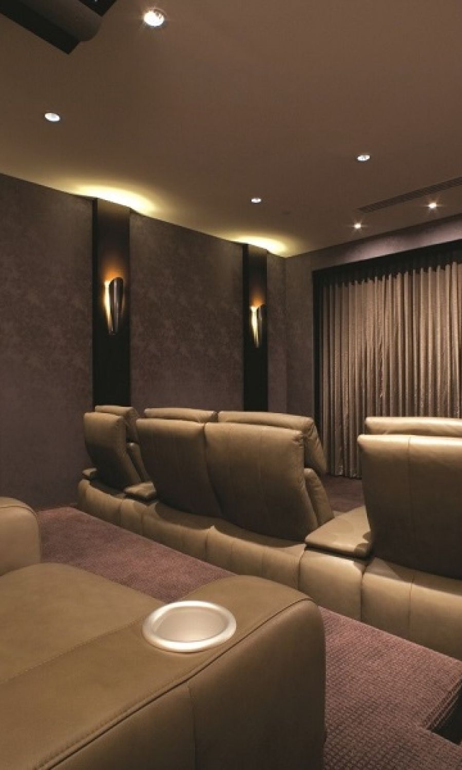 warm toned room with lutron lighting and shades