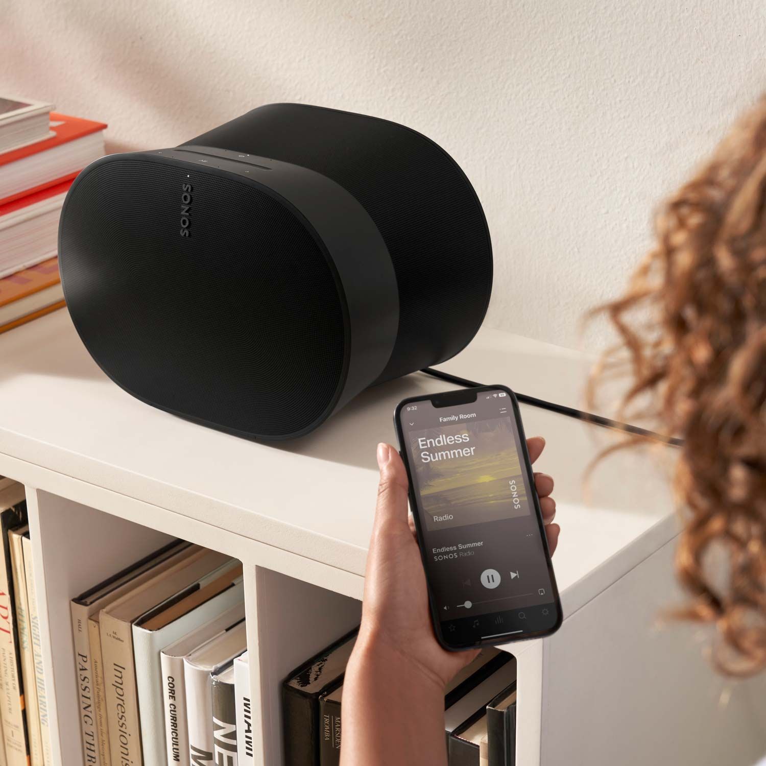 sonos speaker on white bookshelf